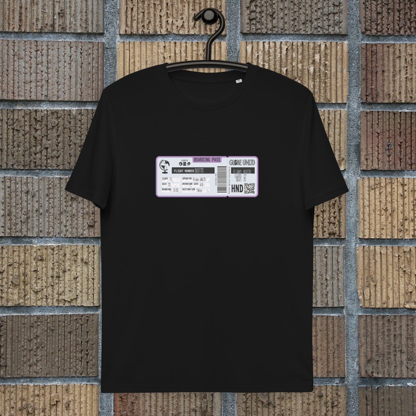 Globe UNLTD Tokyo HND Boarding Card 100% Organic Cotton T-Shirt in Black. Front Facing on Clothes Hanger.