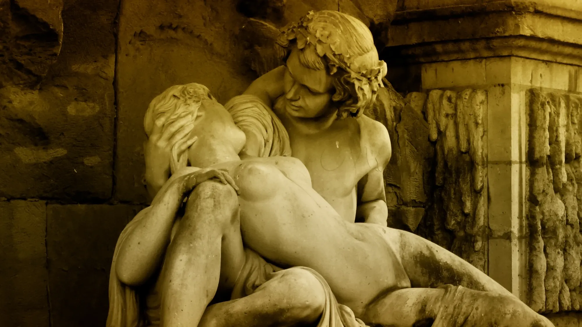 Sculpture of lovers at the Medici Fountain in Jardin du Luxembourg, Paris