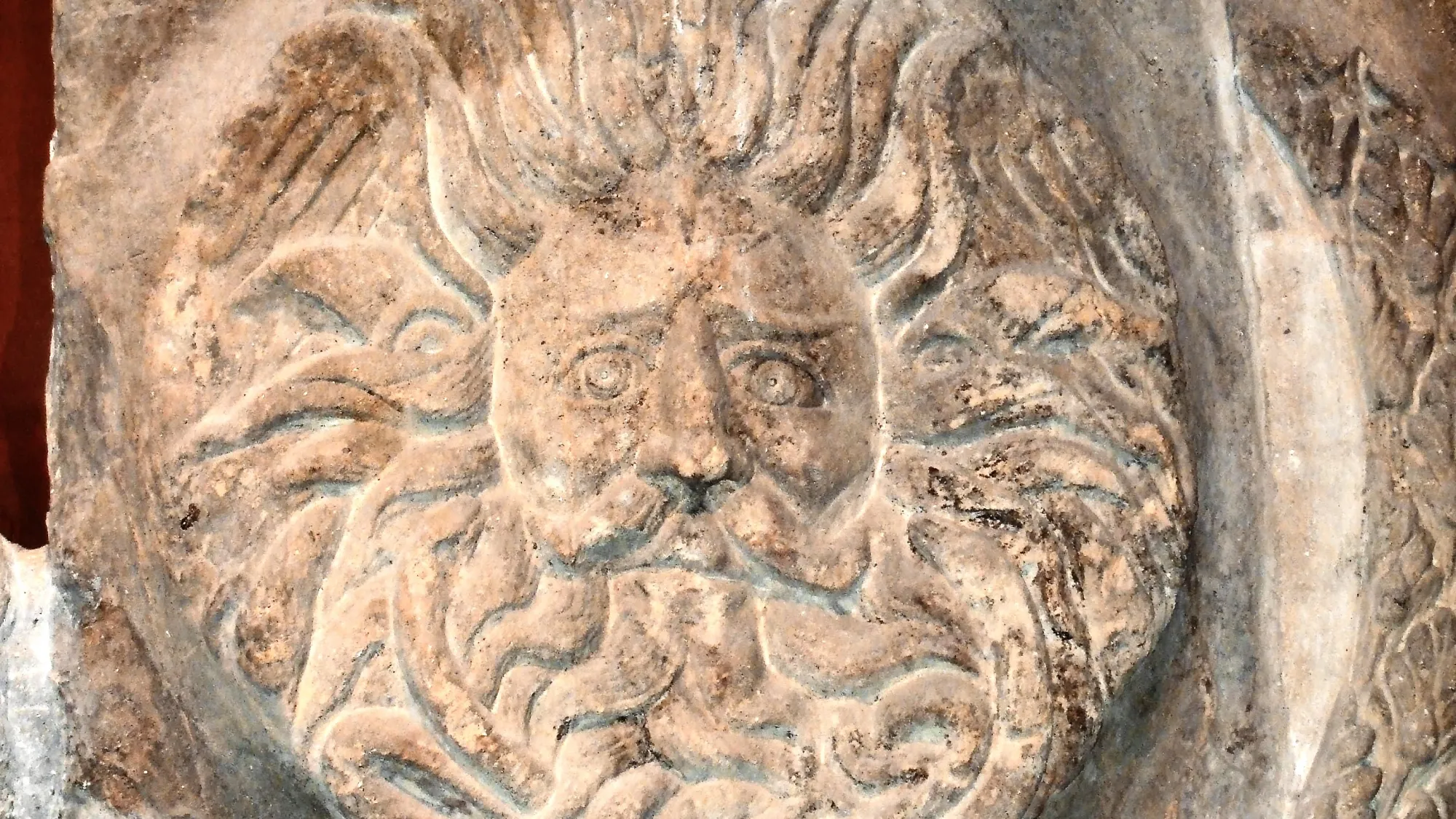 A stone carving that formed part of the Aquae Sulis Temple in Bath. The carving is a depiction of an unusual male gorgon head, which it is believed may be the Greek God 'Oceanus'